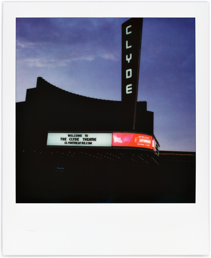 A Polaroid photo taken at nightfall of the Clyde Theatre at Quimby Village in Fort Wayne, Indiana.
