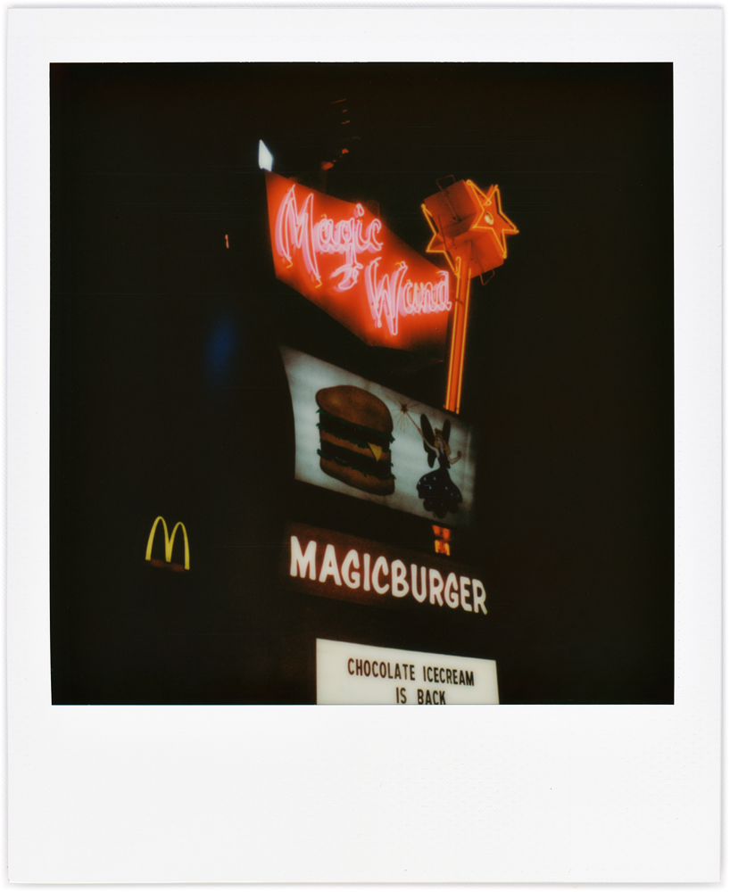 Polaroid snapshot of the neon sign at the Magic Wand Restaurant at night in the small town of Churubusco, Indiana.