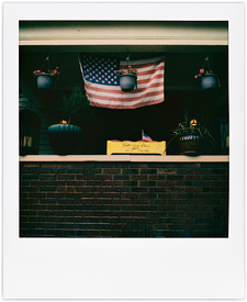 Porch With Flags and Flowerpots