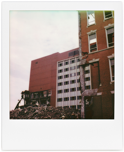 A series of Polaroid photographs of the demolition of Saint Joseph Hospital in Fort Wayne, Indiana.